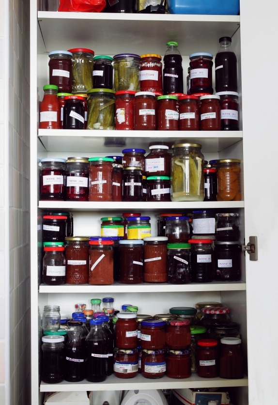 The cupboard is filled ____ food.
