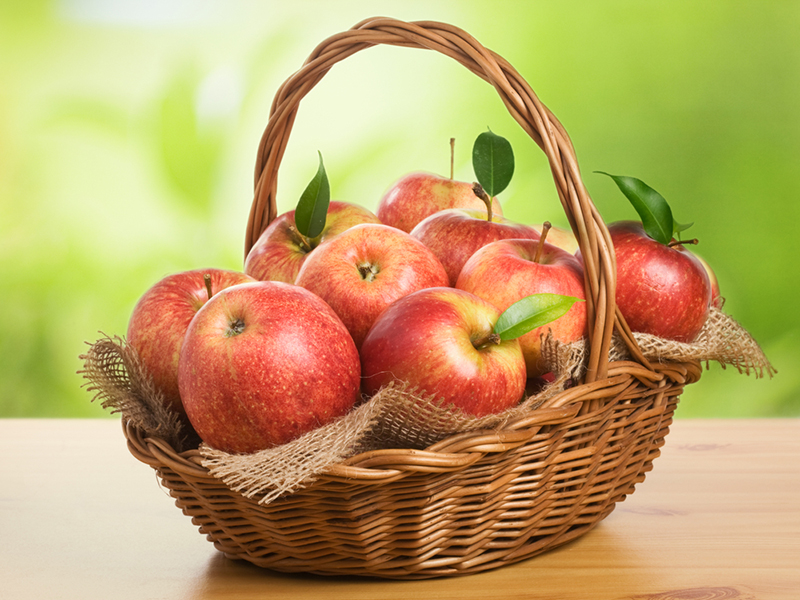 How many apples are there ______ the basket?